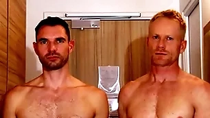 Handsome light-complexioned aptness trainer serviced by a huge dick guy.