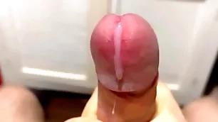 Cumming in close-up with a massive allotment for cum in slow motion / big uncut veiny cock / pissing